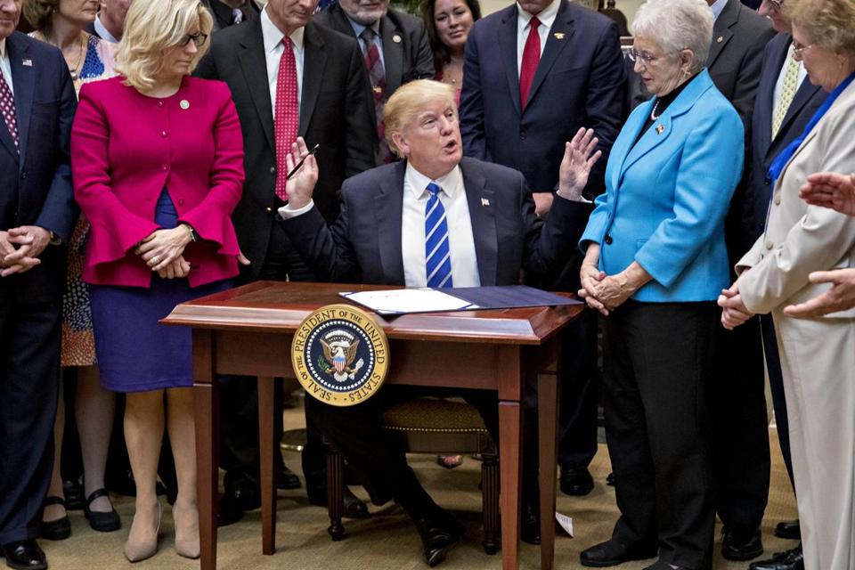President Donald Trump signed bills in the  Roosevelt Room of the White House on Monday.
